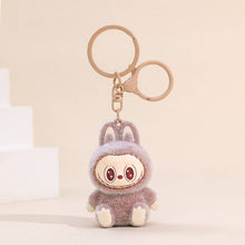Load image into Gallery viewer, Fuzzy brown Labubu Keychain on a beige background
