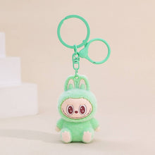 Load image into Gallery viewer, Fuzzy light green Labubu Keychain on a beige background
