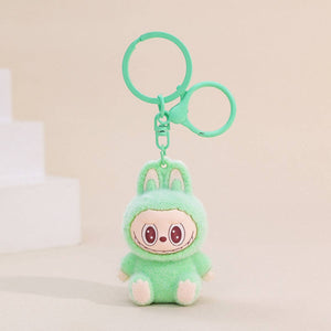 Fuzzy light green Labubu Keychain on a beige background