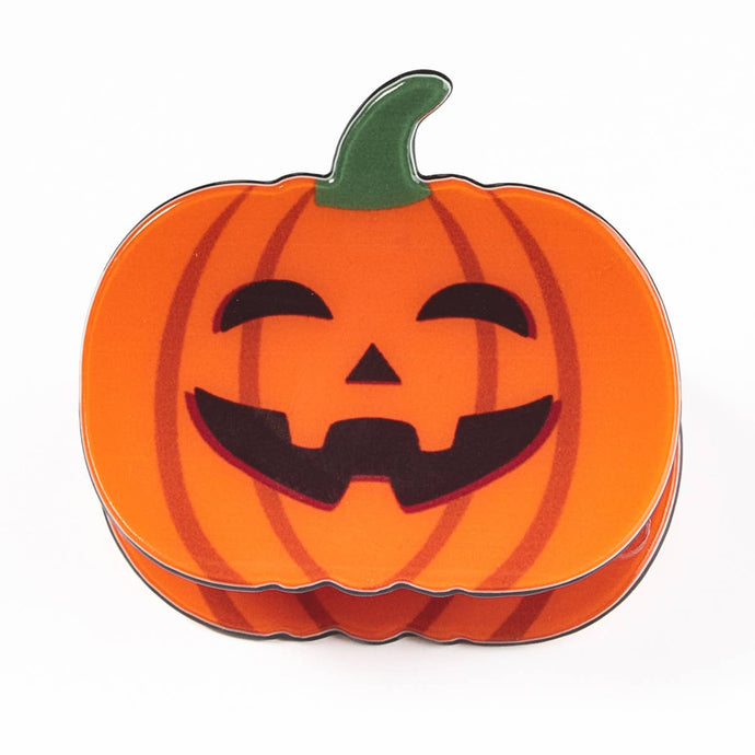 Pumpkin Shaped Hair clip with black face on the front